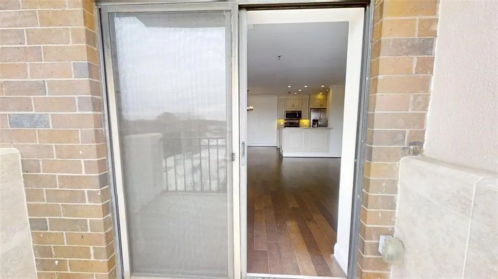 Entrance to property with brick siding