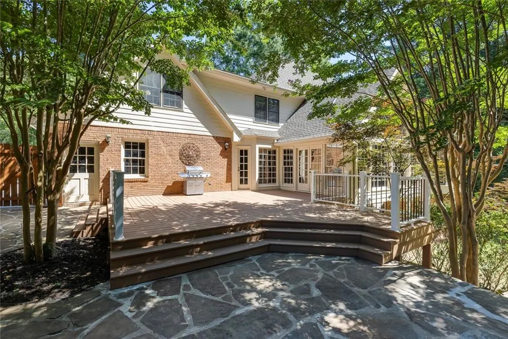 Deck has been enlarged and opens to a stone patio