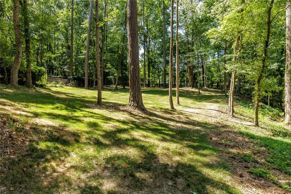 Fenced yard offers so many options for a pool, court or both!