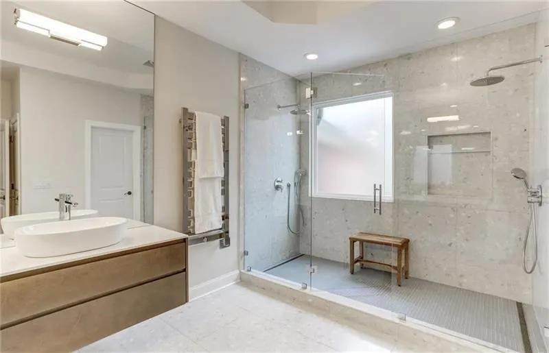 This tremendous double shower features double shower heads and body sprayers with plenty of space to add a large tub making this a wet room if so desired.