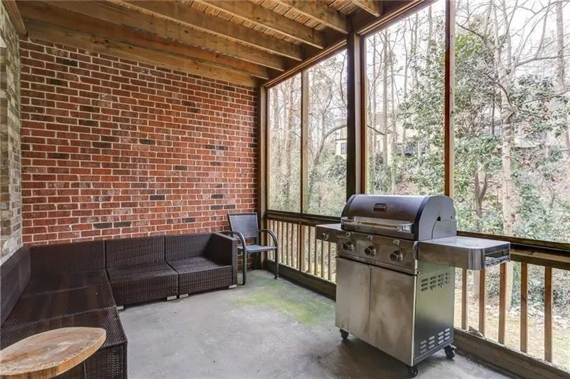 Here, this terrace level patio is used as an additional outdoor year round sitting space! Enjoy grilling out or relaxing with a good book or install a hanging bed from the ceiling and make it a sleep porch. Homeowner has added  a door and stairs to the backyard that can be easily fenced in for your own private space!