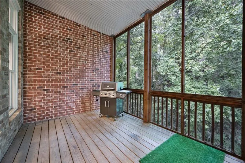Another view of the same main level screened in patio space showing the lush greenery/privacy just beyond - All this in walking distance to City walk! Tons of space outside to walk your furry children within the neighborhood or give them a lovely safe space that they can enjoy the outdoors when you would rather not be on a walk!