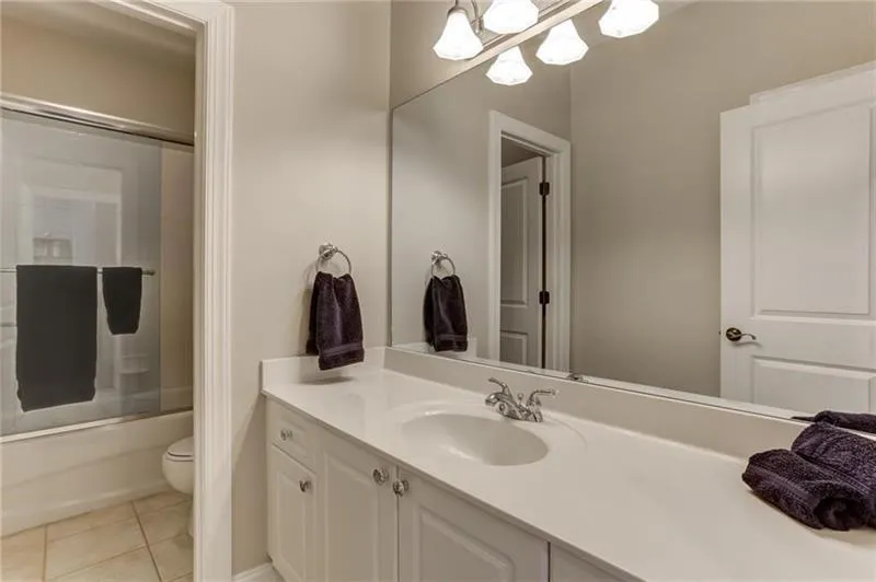 Secondary bathroom on the second floor has tons of counter space and a separate bathtub and water closet for privacy!