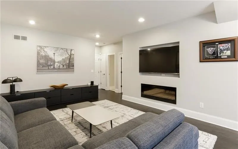 Another view of the terrace level living space showing off the sleek fireplace that will warn up this space in minutes! Who doesn't enjoy the ambiance of a fireplace? This unit easily flips on with the touch of a button!