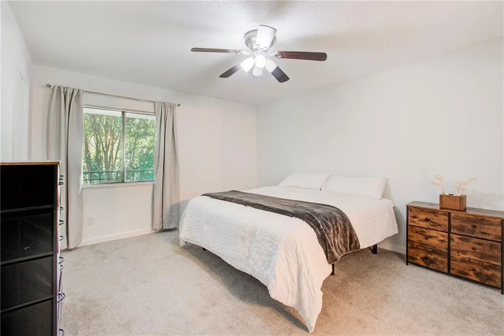 The primary suite is spacious and full of beautiful light.