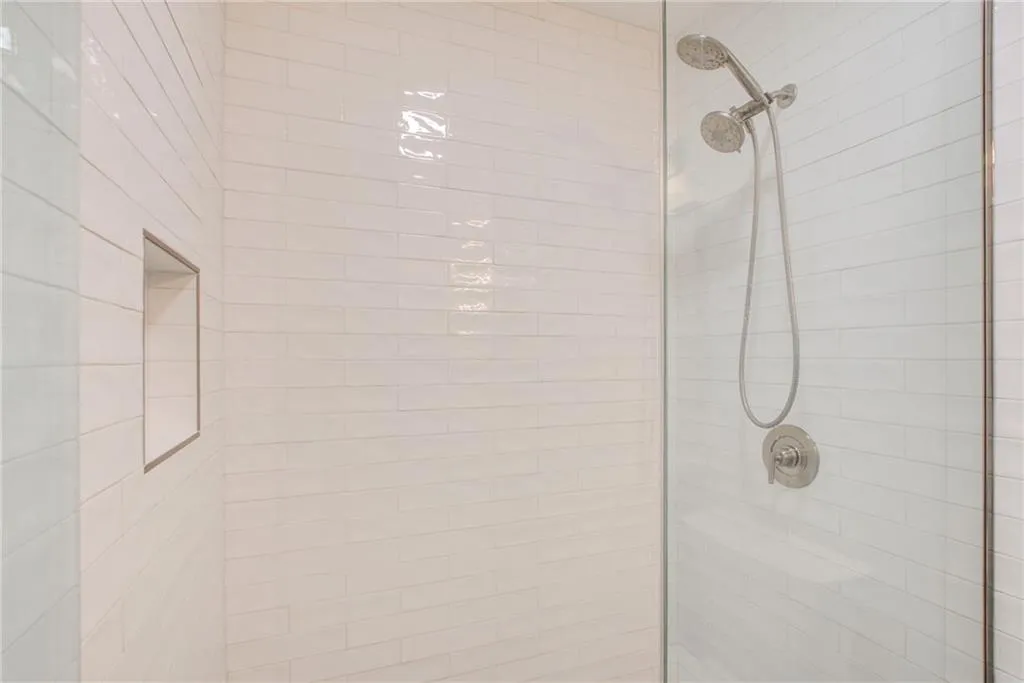 The most wonderful space to start your day. Take a look at this  subway tiled shower with glass doors and  a build in niche. The bathrooms were renovated and the space is spa like. Enjoy!