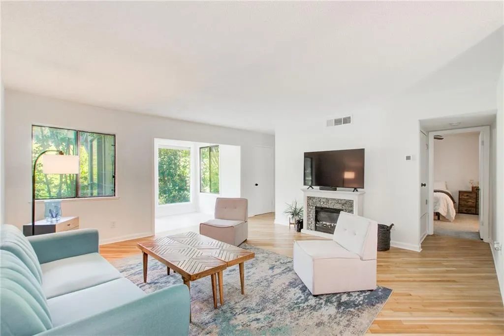 Large open spaces to enjoy living in this fireside living room, sunroom and attached dining room.