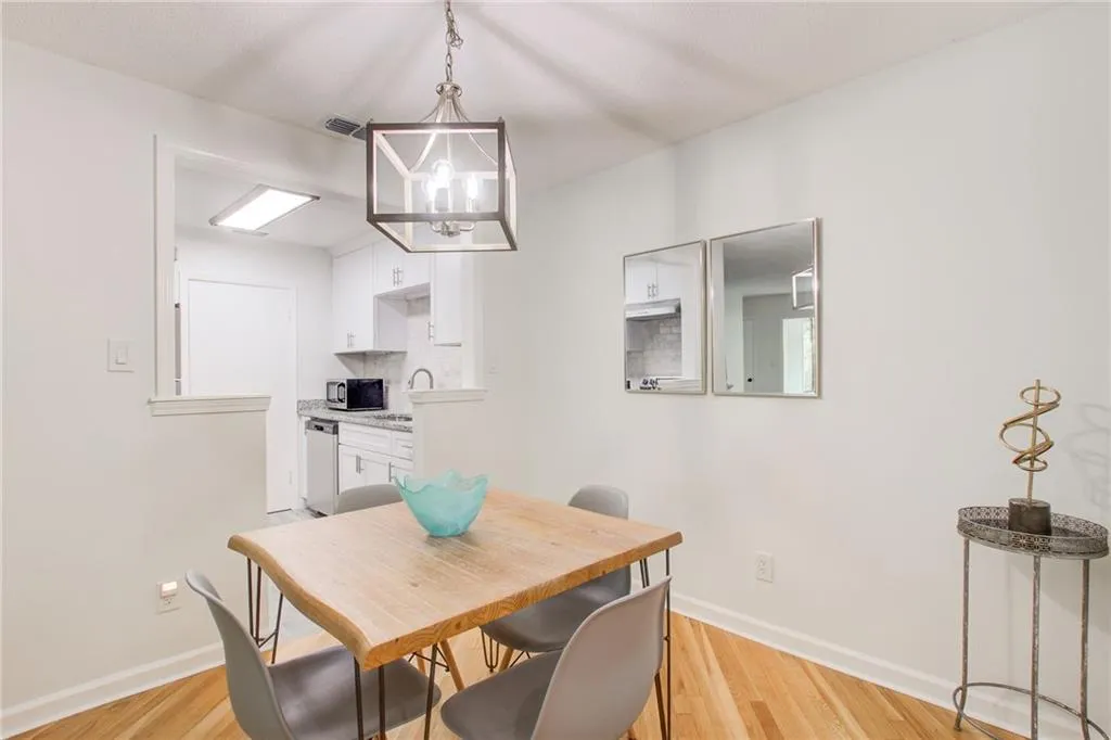 This new kitchen is open to the dining room. Take a look at this beautiful flooring and lighting.