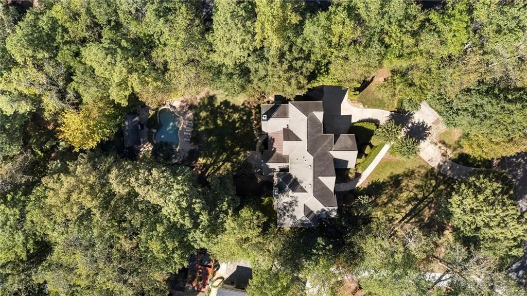 Large, deep set lot surrounded by 20 acres of nature preserve. A quiet oasis right in Sandy Springs