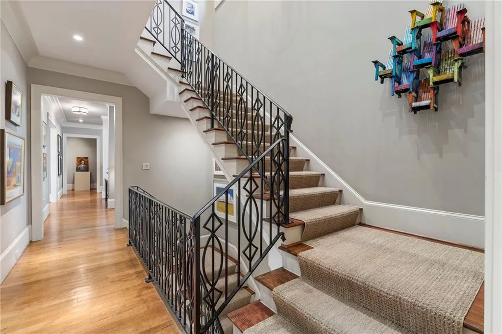Among the many thoughtful details in this home is the custom railing and floating staircase that guides you through all three floors of the home.