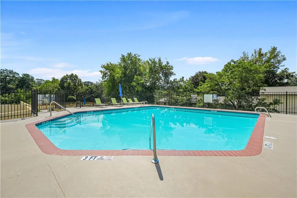 Community pool with a patio area