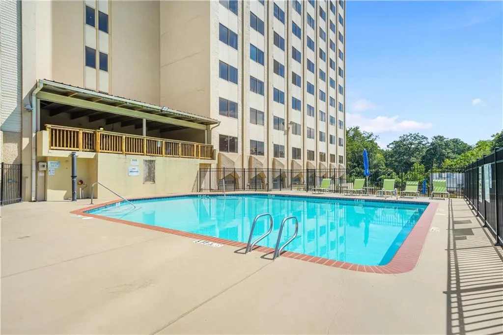 Community pool with a patio