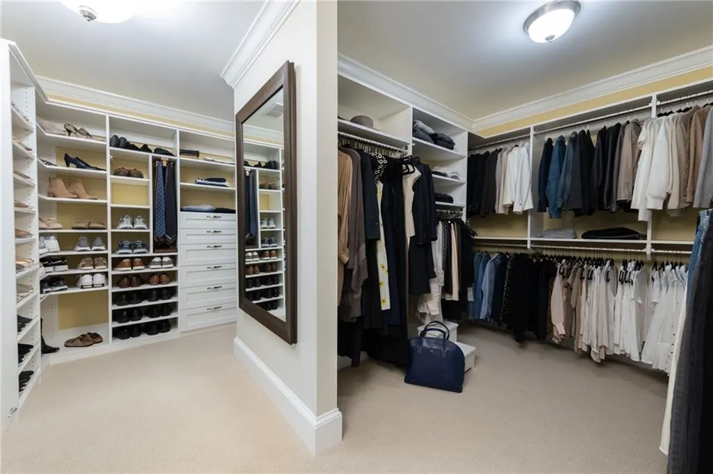 Primary closet with his/her