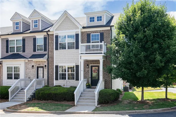 Brick and shingle exterior with dormer windows