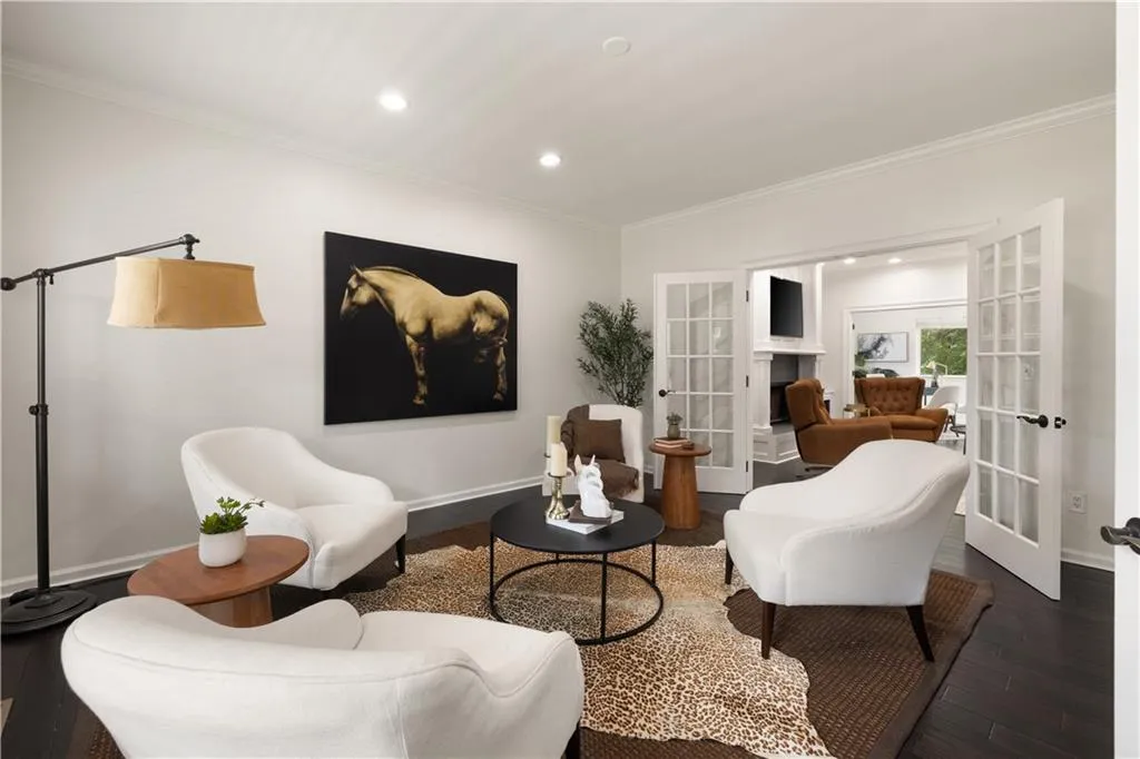 Living area featuring french doors, wood finished floors, recessed lighting, and crown molding
