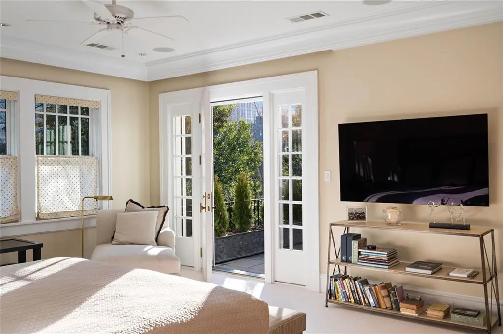 Bedroom featuring ornamental molding, carpet, ceiling fan, and access to exterior