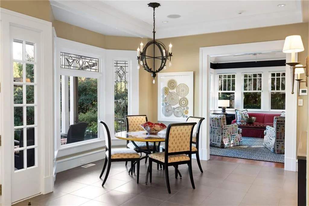 Dining room featuring light tile patterned flooring and a chandelier