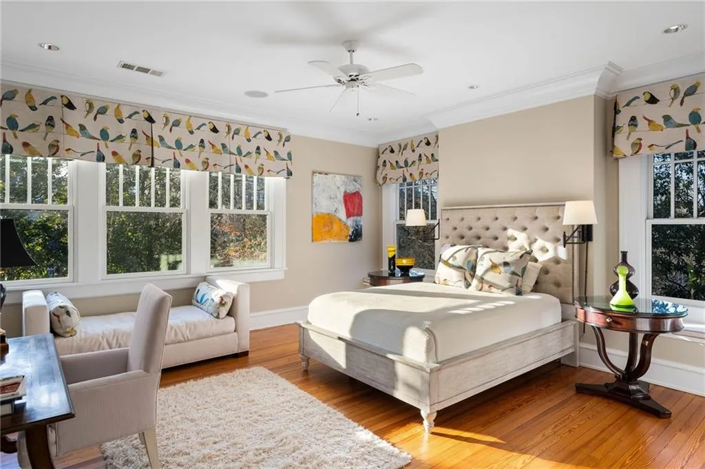 Bedroom with crown molding, wood finished floors, a ceiling fan, and recessed lighting