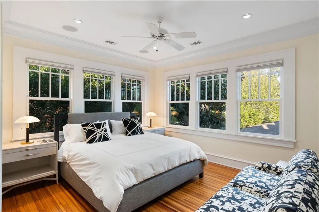 Bedroom featuring wood finished floors, crown molding, ceiling fan, and recessed lighting
