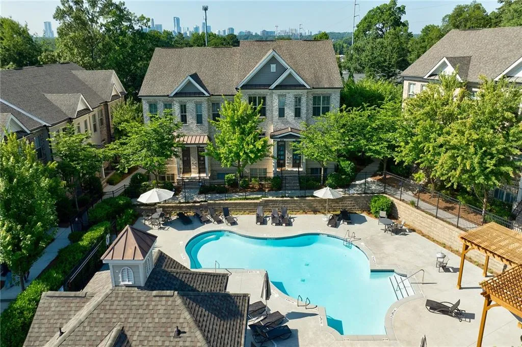 Courtyard view of the pool and front door to the left