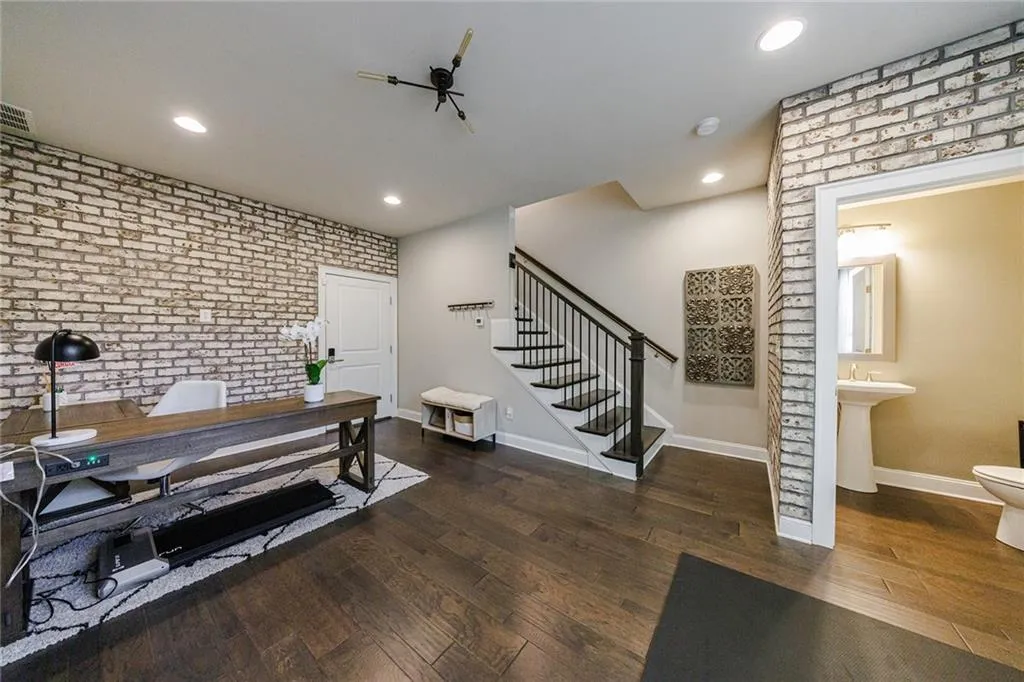 The lower level offers a versatile flex space for an office, workout room, or playroom