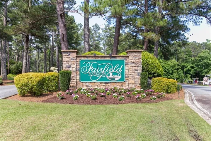 Community sign featuring a yard