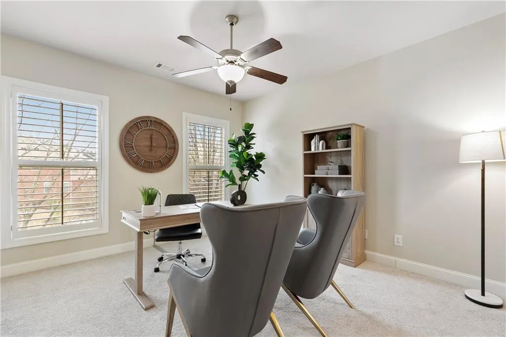 Secondary bedroom setup as office upstairs with walk-in closet