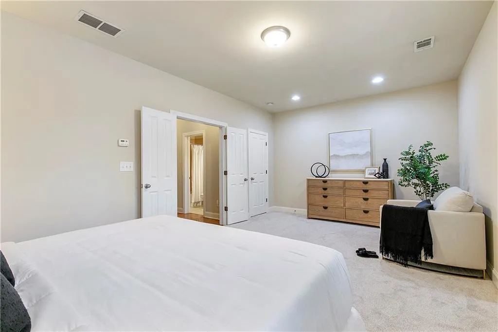 Bedroom with light colored carpet