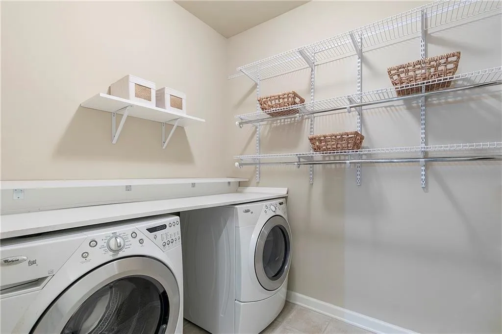 Washroom featuring washer and dryer