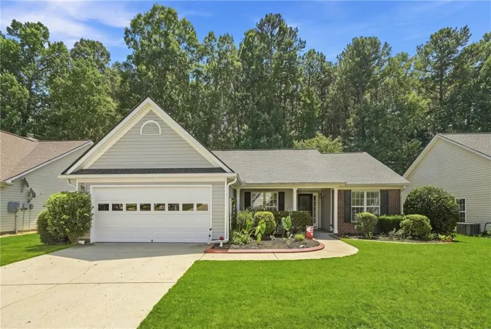 Ranch-style exterior with gray siding and brick accents