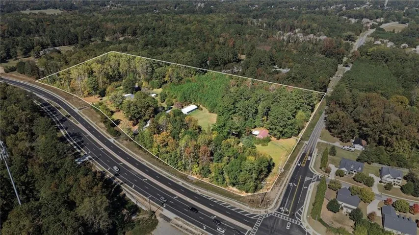 View of property location with property boundaries highlighted and a forest