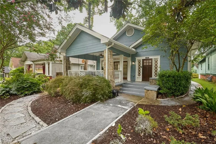 Craftsman-style exterior featuring blue siding and white trim