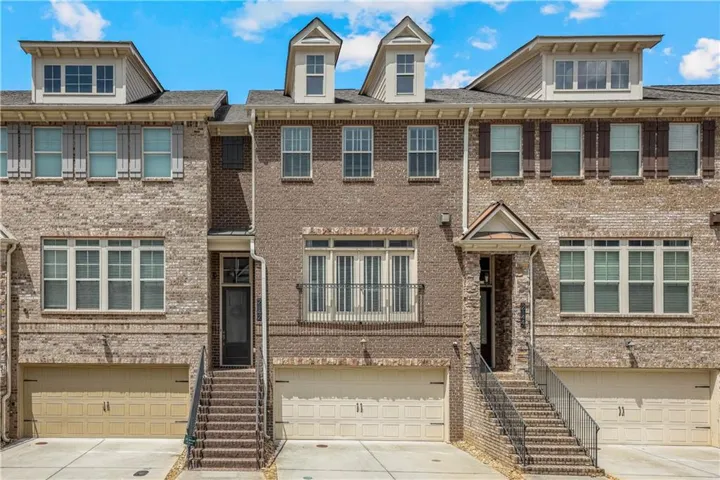 Brick exterior facade with multiple dormer windows