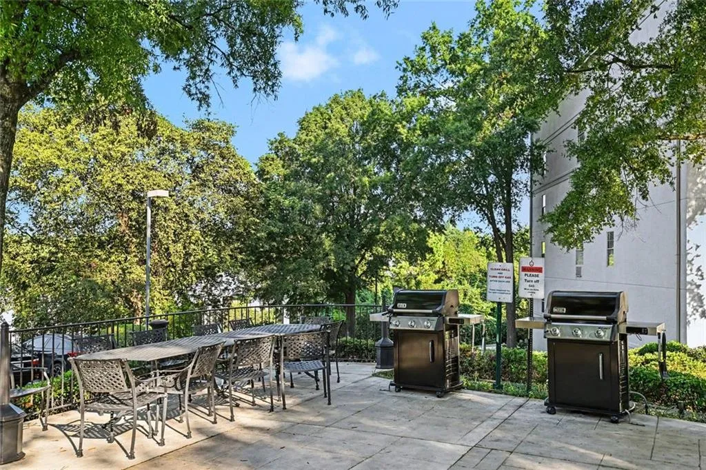 Community Amenities - Sun Deck with Patio Seating and Grills