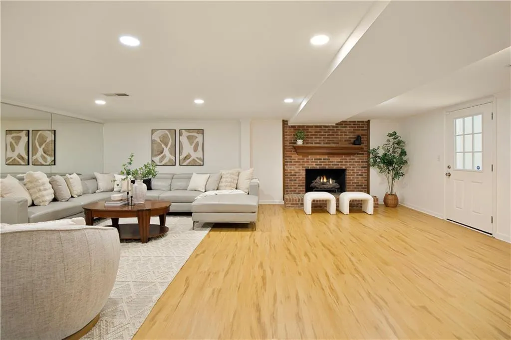Designed for versatility, this open-concept lower level provides ample room for both relaxation and entertaining.