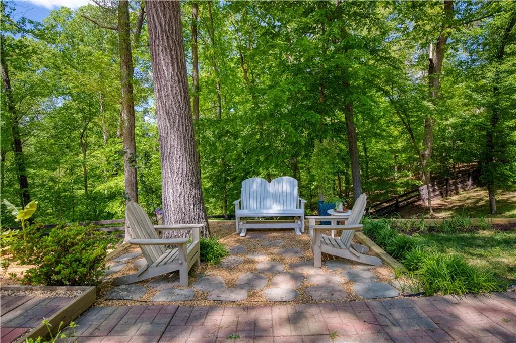 A cozy seating area provides the perfect spot to unwind and enjoy the peaceful surroundings.
