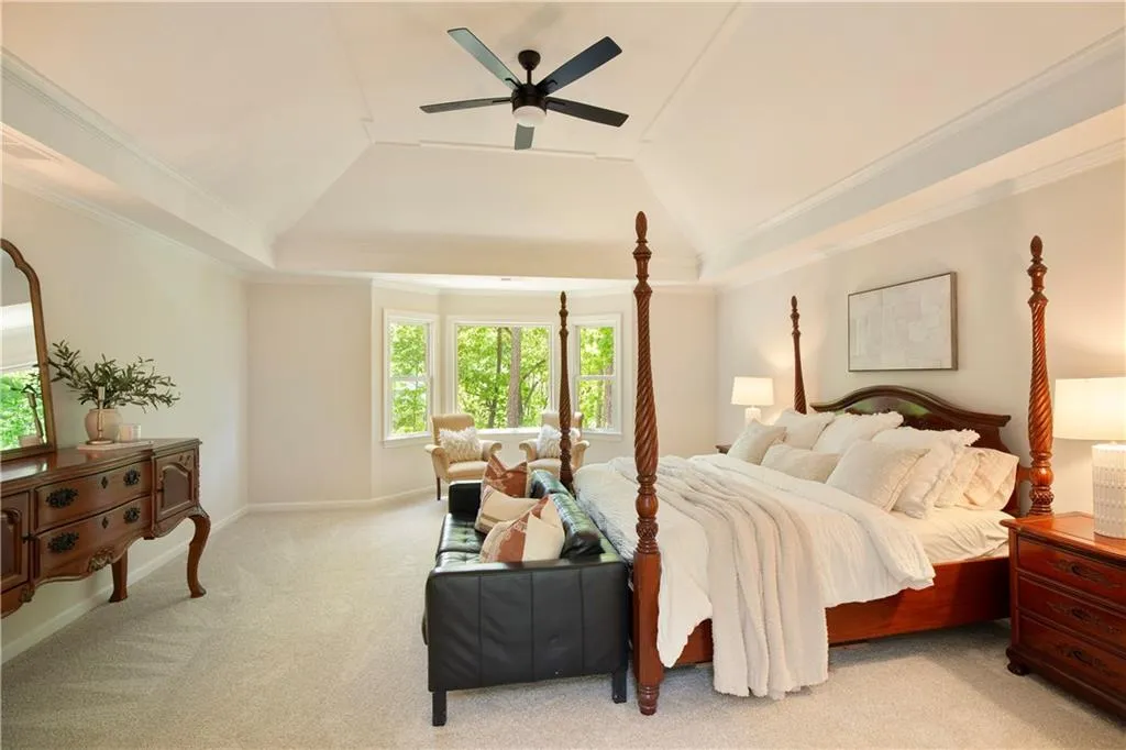 With room for a sitting area, the primary suite creates a cozy spot for relaxation.