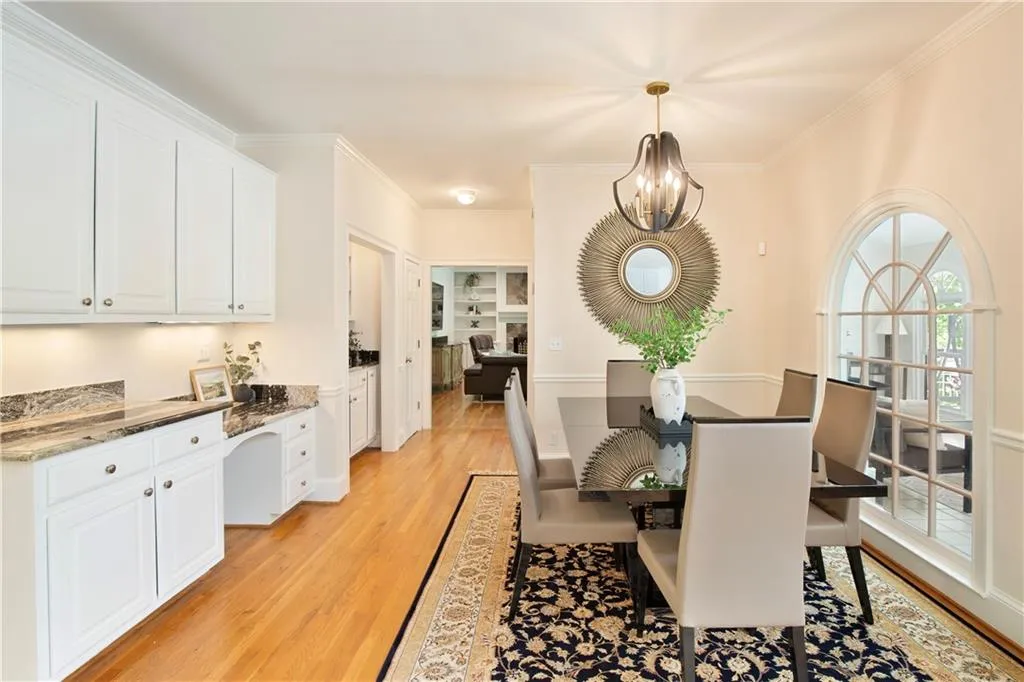 Another view highlights the casual dining area's seamless connection to adjacent living spaces, enhancing flow for gatherings.