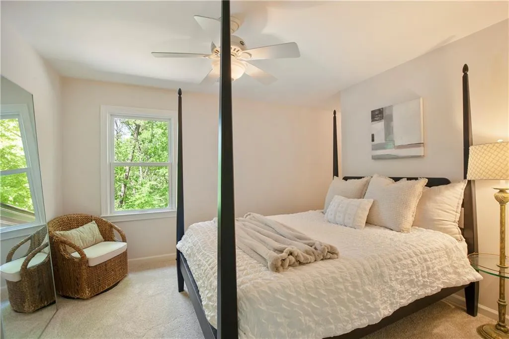 Another bedroom offers a cozy retreat with soft natural light and neutral finishes, ready to suit a variety of needs.