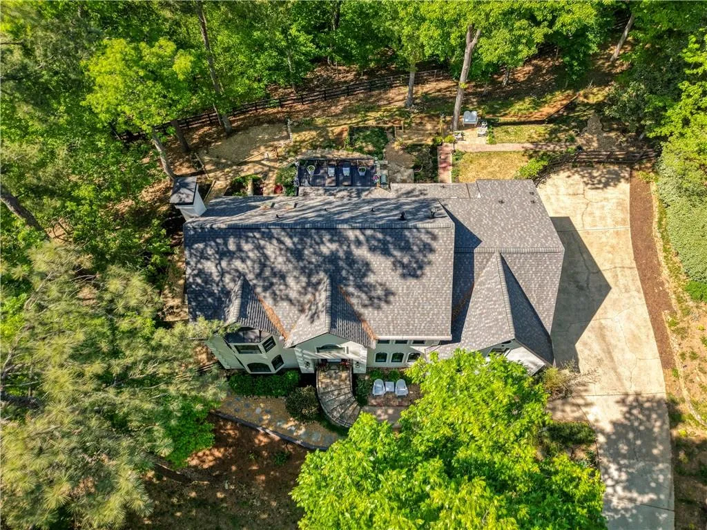From above, the thoughtfully designed outdoor living spaces and expansive deck are beautifully integrated into the landscape.