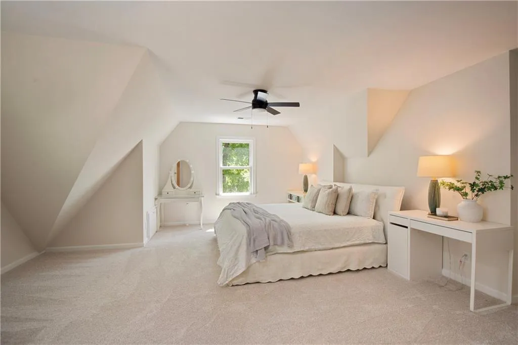 The upper-level bonus space provides flexibility for a guest suite, media room, or home office, enhanced by its spacious layout and natural light.