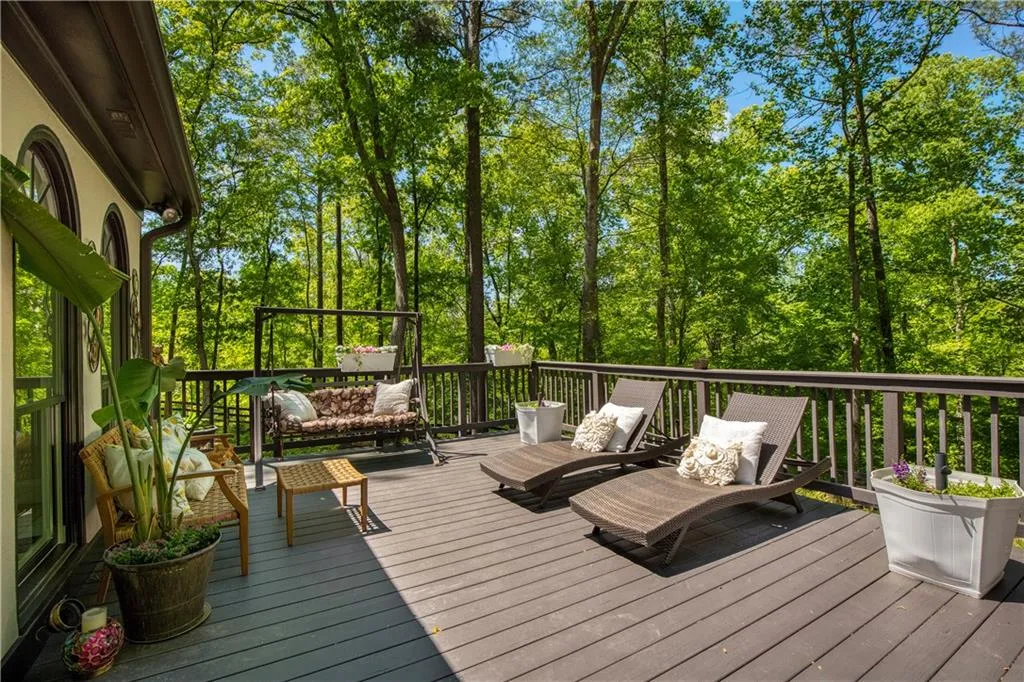 Surrounded by mature trees, the outdoor living spaces provide a peaceful, private setting ideal for relaxing or entertaining.