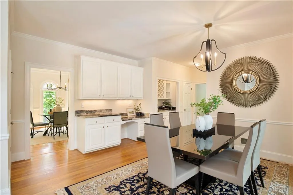 The casual dining area overlooks the sunroom and is adjacent to the custom wet bar.