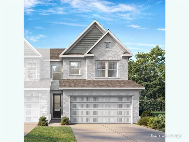 Stone veneer facade with gabled roofline