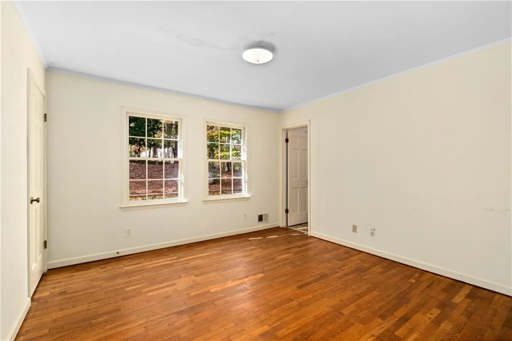 Main floor secondary bedroom - all bedrooms have hardwood floors!
