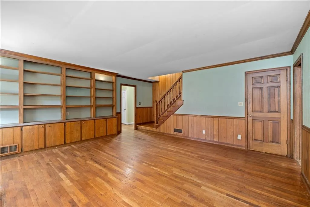 Staircase to upper level, door to huge storage closet