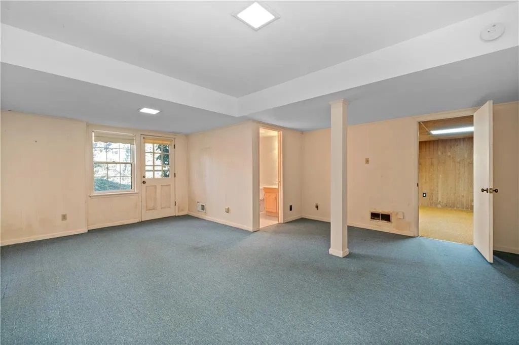 Wide open basement room with full bath and exterior access!