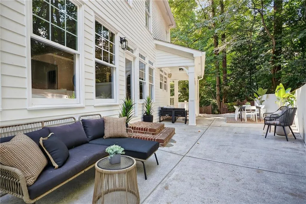 View of patio with an outdoor hangout area and outdoor dining area