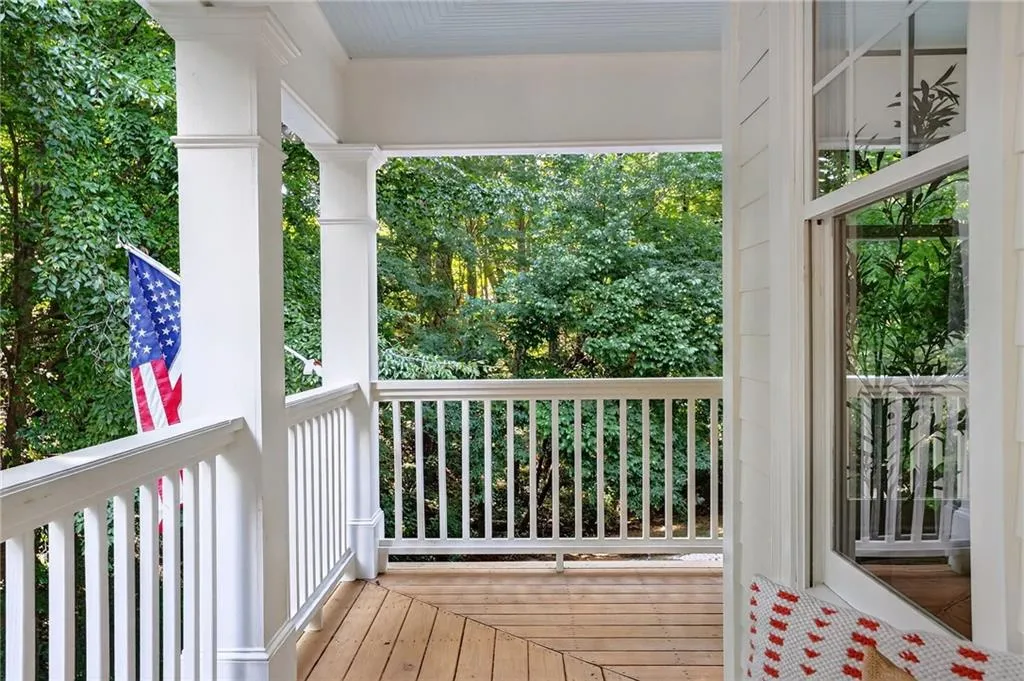 Porch featuring view of scattered trees