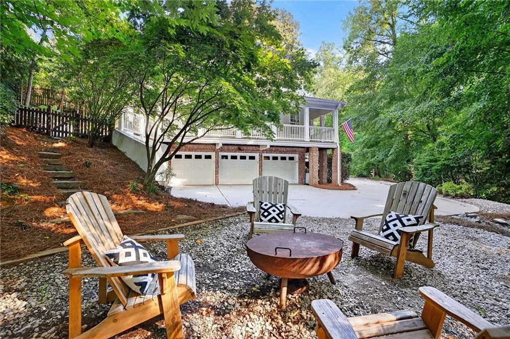 View of patio / terrace featuring concrete driveway and an attached garage